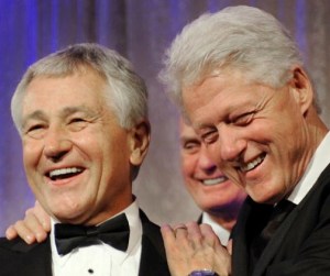 Senator Chuck Hagel (L) enjoys a laugh w