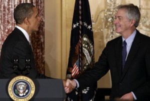 U.S. President Barack Obama shakes hands with Deputy Secretary of State William Burns at the Diplomatic Corps holiday reception at the State Department in Washington