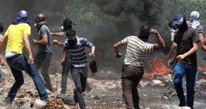 Palestinian protesters clash with Israeli security forces on the West Bank in June.