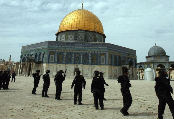 Israeli riot police keep position at Jerusalem's al-Aqsa mosque compound during clashes with Palestinian demonstrators following Friday prayers on March 8, 2013. Palestinians enraged by reports that an Israeli policeman mishandled a Koran battled riot officers at Jerusalem's Al-Aqsa mosque compound with stones and petrol bombs, police and witnesses said. Photo by Mahfouz Abu Turk
