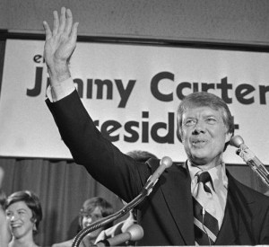 Georgia Gov. Jimmy Carter waves to a crowd gather in Atlanta on Thursday, Dec. 12, 1974 where he announced officially that is a Democratic candidate for the presidency. Carter promised to “restore integrity, confidence and businesslike management to the federal government.” He said in Washington earlier that he plans to run in several state primaries. (AP Photo/BJ)